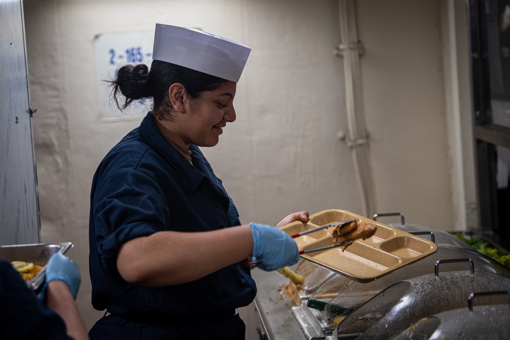 Nimitz Sailor Serves Food