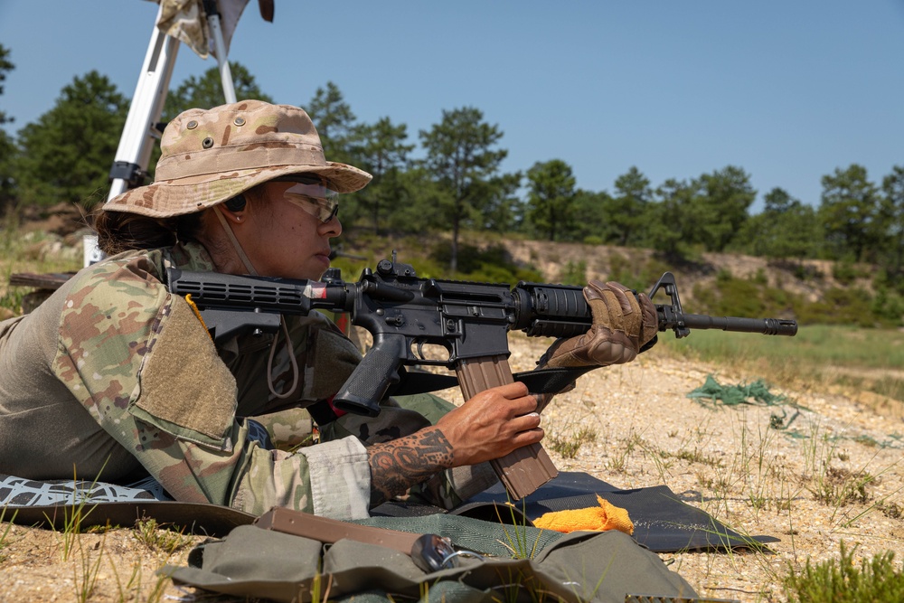 1st Lt. Jessica Romero loads her M4 rifle