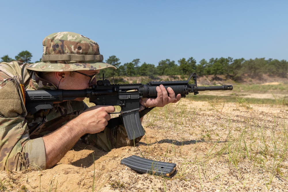 Staff Sgt. Zachary Mills fires an M4 rifle