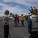 Rear Adm. Adan Cruz arrives aboard Abraham Lincoln