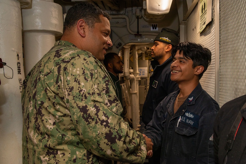 Rear Adm. Adan Cruz greets O’kane Sailors