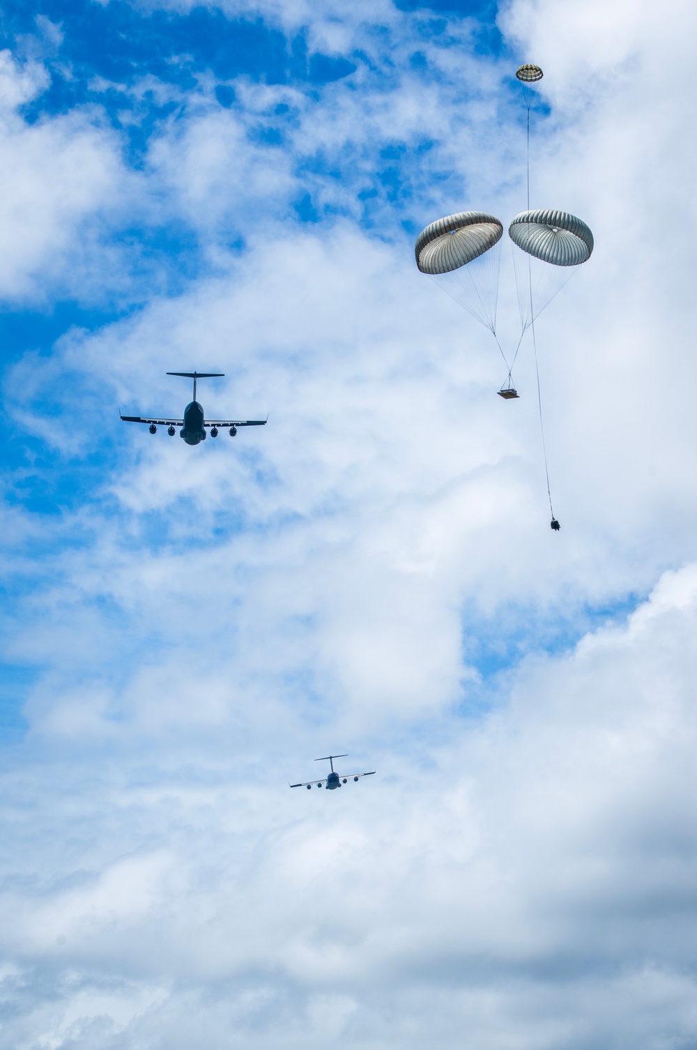 204th and 535th Airlift Squadrons Conduct Airdrop Training