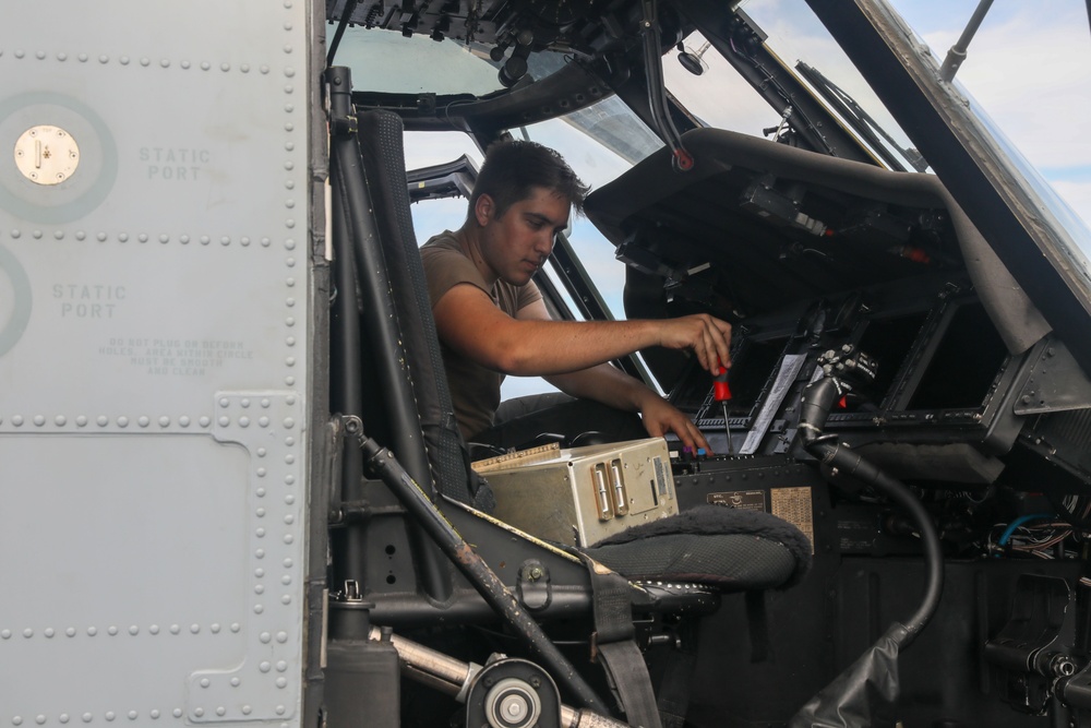 Sailors aboard the USS Howard conduct routine maintenance on a Sea Hawk helicopter in the South China Sea