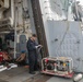 Sailors aboard the USS Howard test an emergency breathing air compressor in the South China Sea