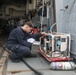 Sailors aboard the USS Howard test an emergency breathing air compressor in the South China Sea