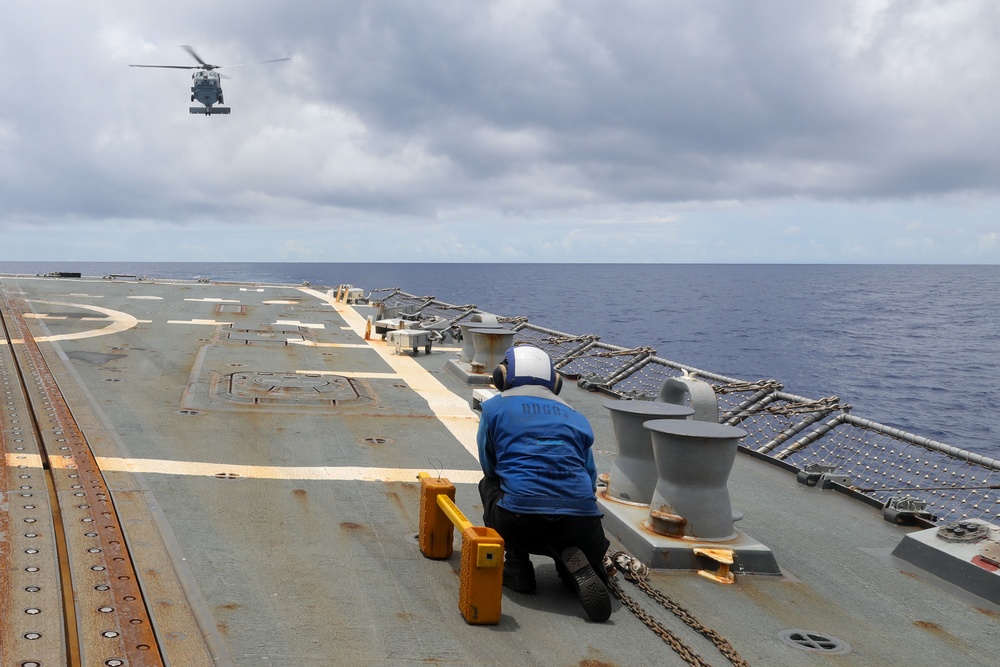 Sailors aboard the USS Howard conduct flight quarters in the South China Sea