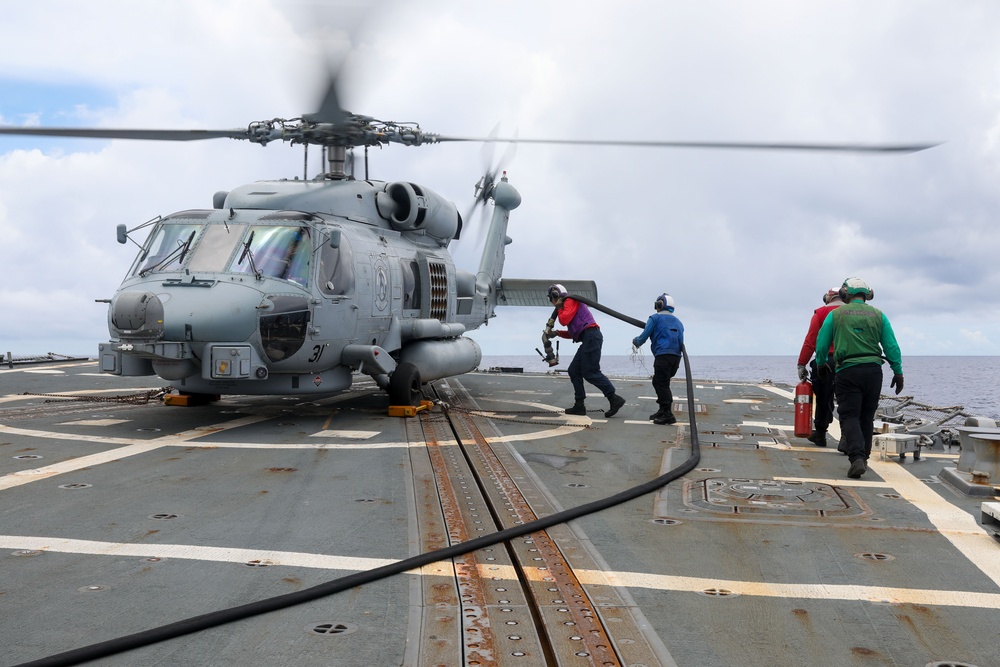 Sailors aboard the USS Howard conduct flight quarters in the South China Sea