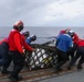 Sailors aboard the USS Howard conduct a replenishment-at-sea with the USNS Cesar Chavez in the South China Sea