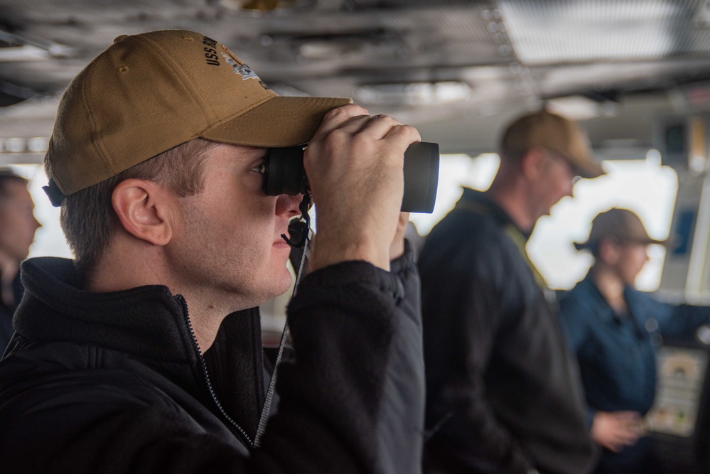 USS Ronald Reagan (CVN 76) Sailors stand watch in the pilot house