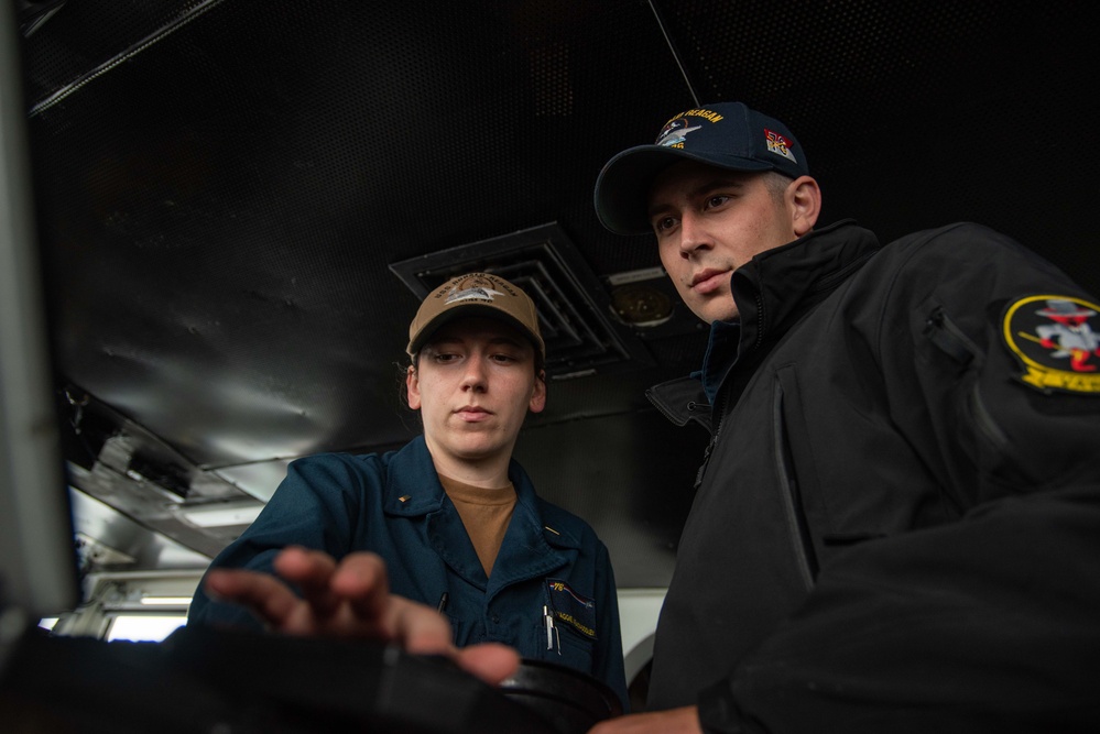 USS Ronald Reagan (CVN 76) Sailors stand watch in the pilot house