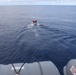 Sailors aboard the USS Howard conduct small boat operations in the South China Sea