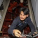 Sailors aboard the USS Howard conduct an engineering training team drill in the South China Sea