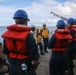 Sailors aboard the USS Howard conduct a small boat operations in the South China Sea