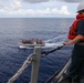 Sailors aboard the USS Howard conduct a small boat operations in the South China Sea