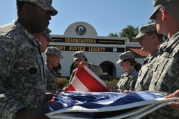 Soldiers folding flag