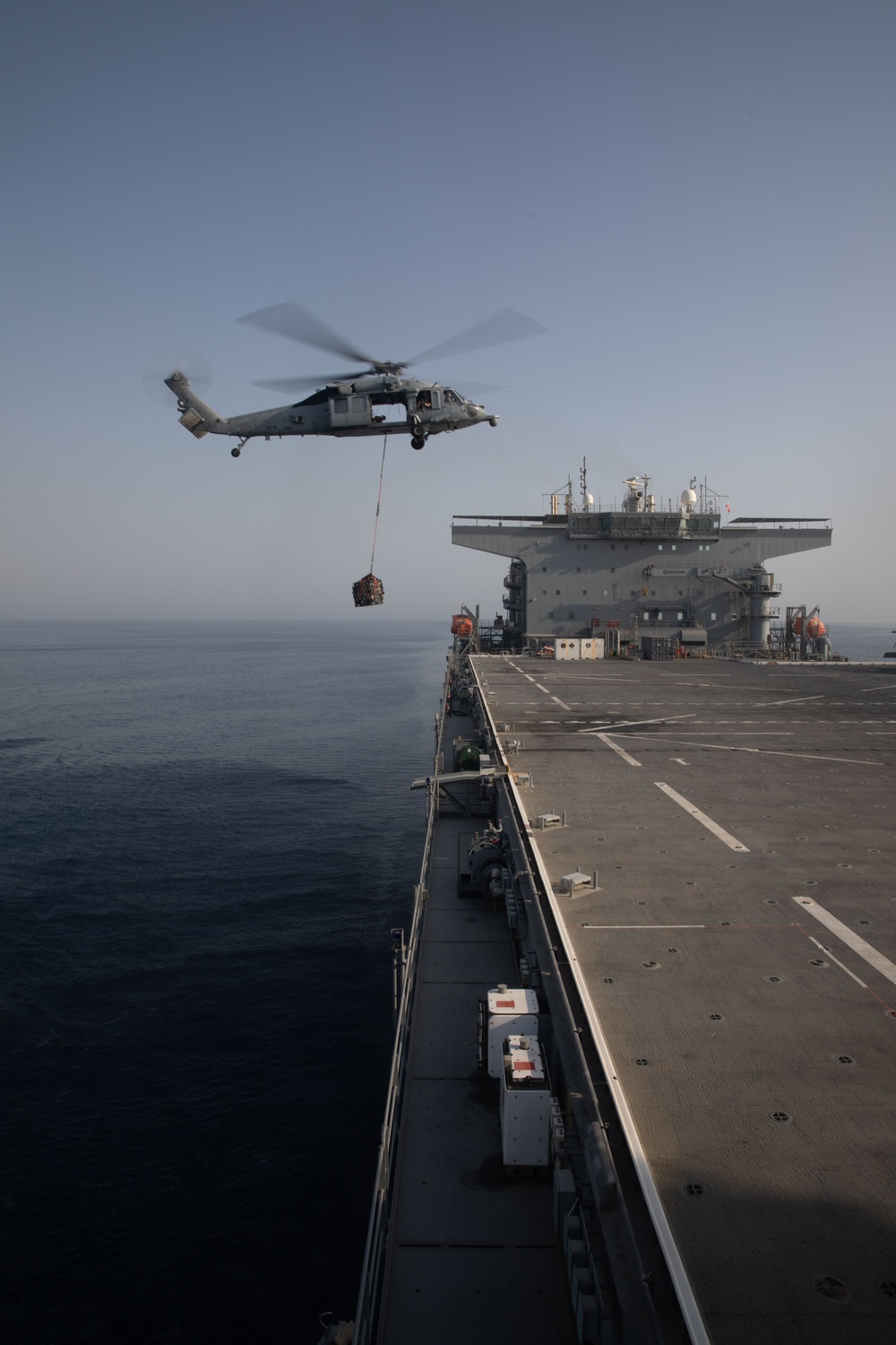 USS Lewis B. Puller Conducts a Supply Transportation Drill with HSC-26