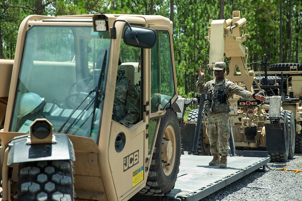 356th Quartermaster Company loads forklift after logistical support