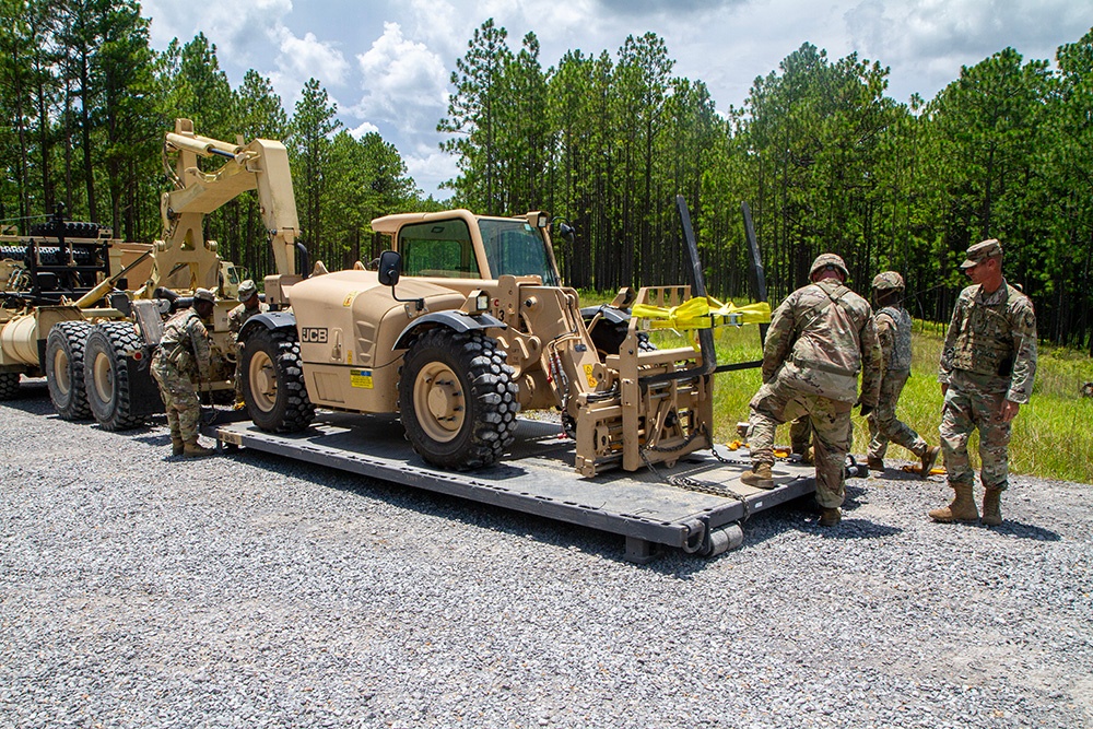 356th Quartermaster Company loads forklift after logistical support