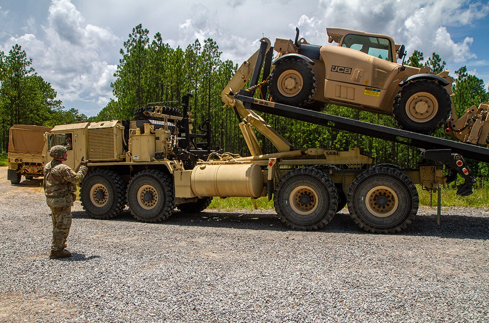 356th Quartermaster Company loads forklift after logistical support