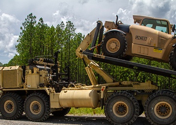 356th Quartermaster Company loads forklift after logistical support