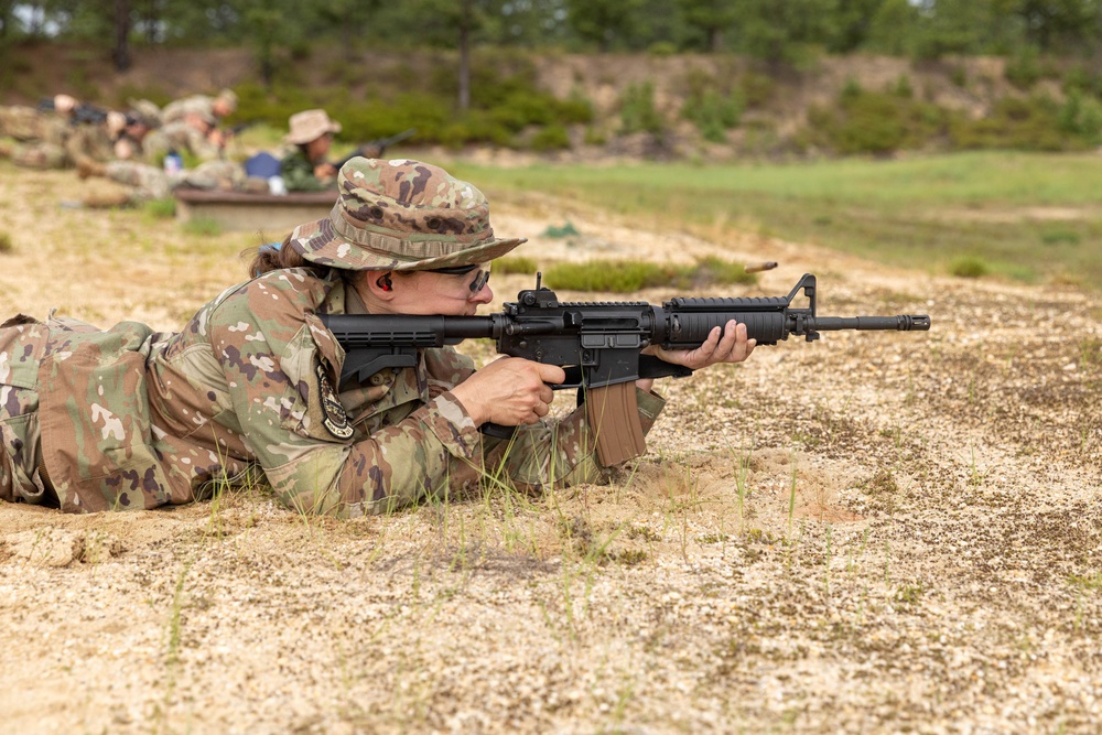 Maj. Mandy Kannapel fires an M4 rifle
