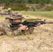 Maj. Mandy Kannapel fires an M4 rifle