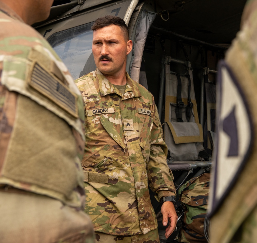 1st Cavalry Division Black Hawk Flight Celebrates Reenlistments and Trains Pilot