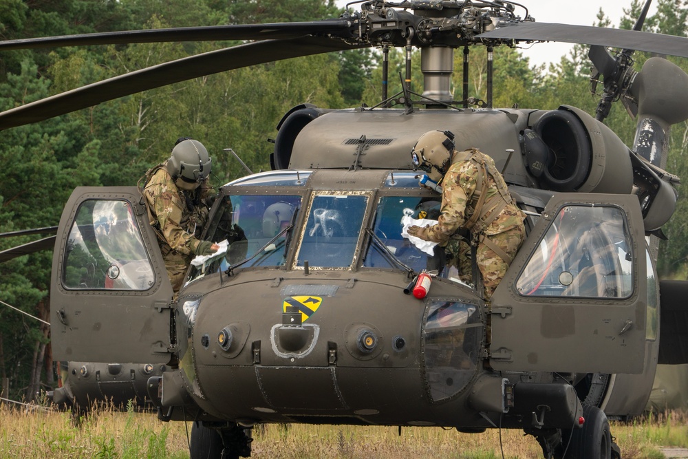 1st Cavalry Division Black Hawk Flight Celebrates Reenlistments and Trains Pilot