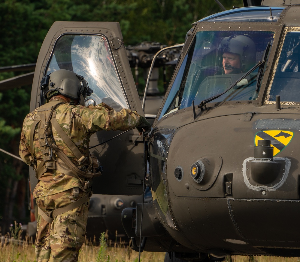 1st Cavalry Division Black Hawk Flight Celebrates Reenlistments and Trains Pilot