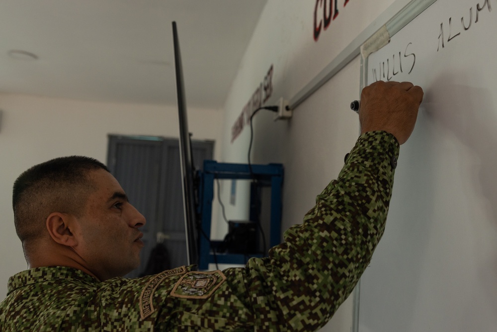 U.S. Marines with Littoral Craft Company Charlie attend classroom lecture during the Colombian Fluvial Operations Course