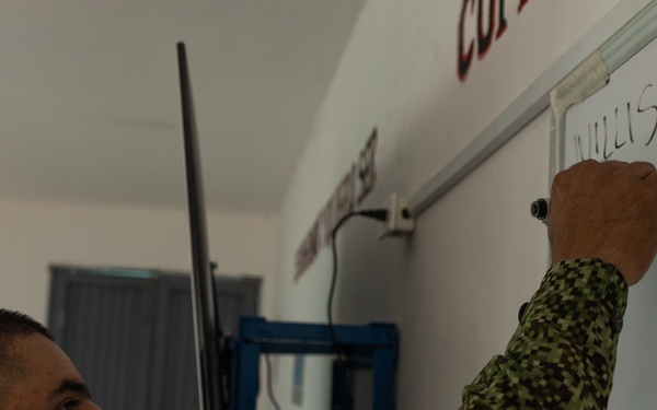 U.S. Marines with Littoral Craft Company Charlie attend classroom lecture during the Colombian Fluvial Operations Course