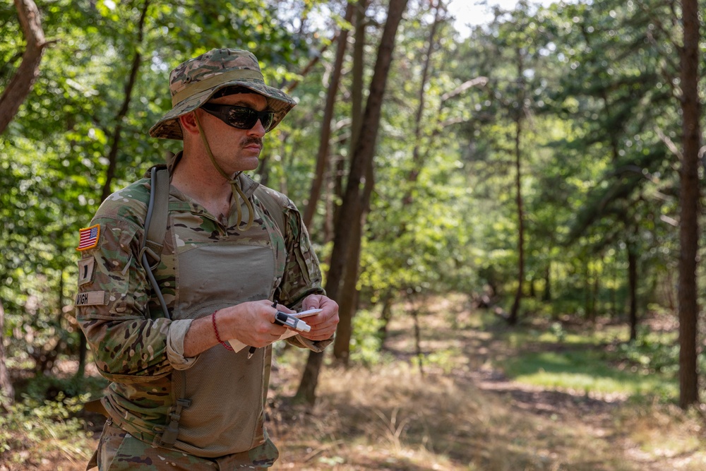 1st Lt. Michael Vigh checks his map