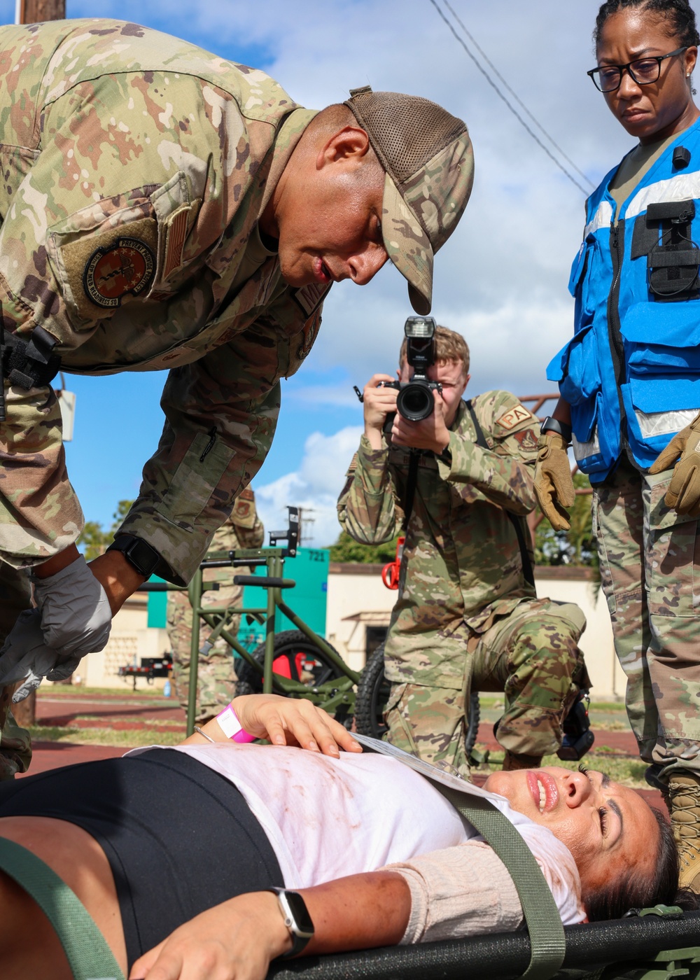 Staff Sergeant Richard Rodruiguez triages a patient during a Mass Casualty Drill