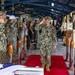 Capt. Shaun Lieb shares a final salute as he departs from CTF 75