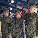 Left to right: Incoming and outgoing commanders of CTF 75 salute alongside the commander of Naval Expeditionary Combat Command.