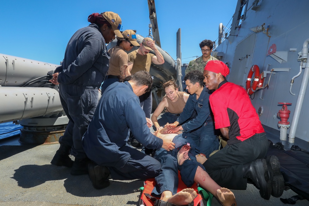 Sailors aboard the USS Howard conduct a medical training team dill in the South China Sea