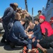 Sailors aboard the USS Howard conduct a medical training team dill in the South China Sea