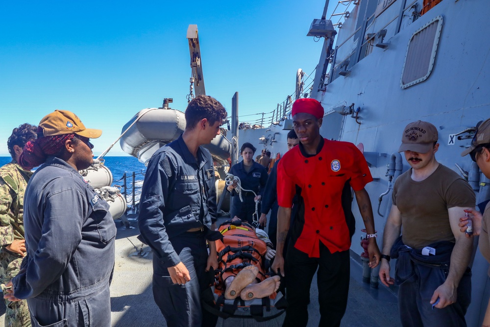 Sailors aboard the USS Howard conduct a medical training team drill in the South China Sea