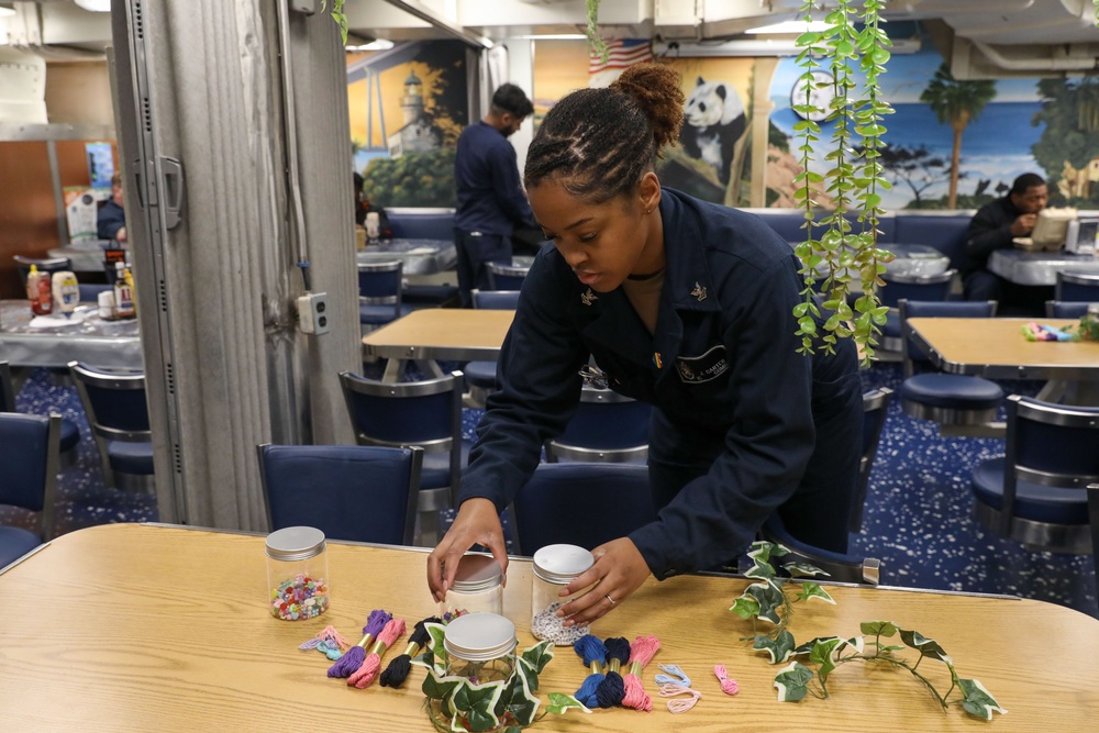 Sailors aboard the USS Howard host a friendship bracelet making event in the South China Sea