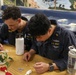 Sailors aboard the USS Howard host a friendship making event in the South China Sea