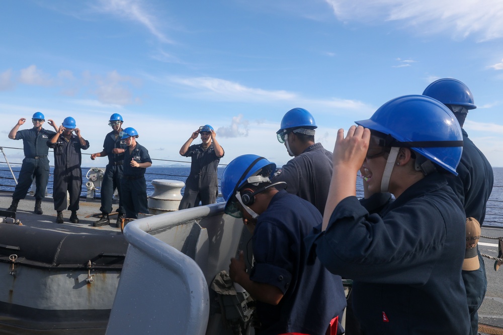 Sailors aboard the USS Howard conduct a sea and anchor detail in Okinawa, Japan