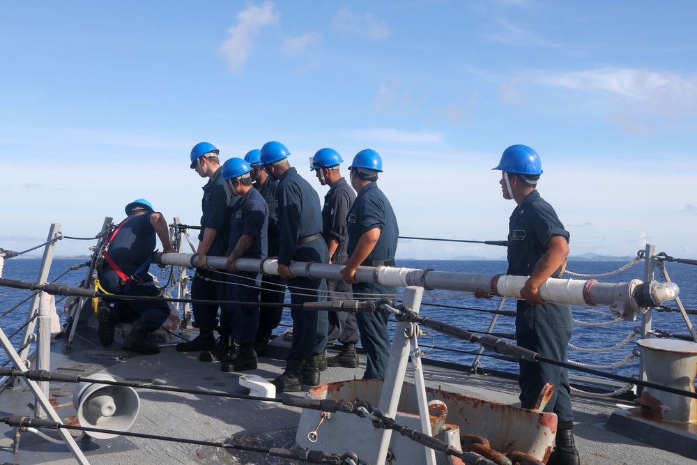 Sailors aboard the USS Howard conduct a sea and anchor detail in Okinawa, Japan