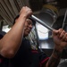 USS Ronald Reagan (CVN 76) Sailor prepares food