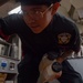 USS Ronald Reagan (CVN 76) Sailor prepares food