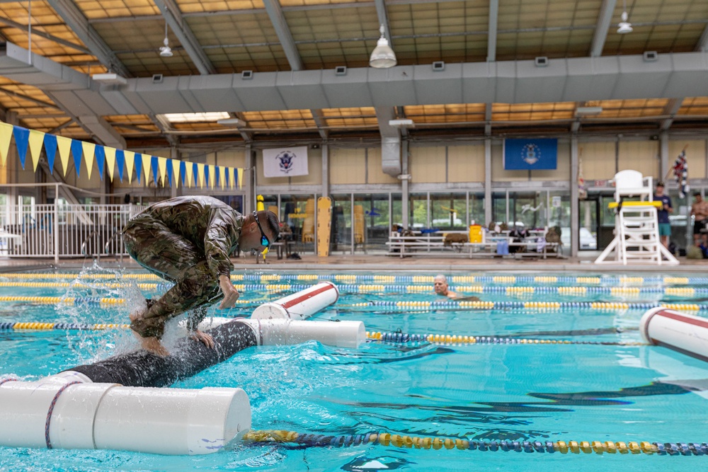 Capt. Jack Straub jumps from a water obstacle