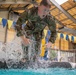 Sgt. Thomas Hunt jumps from a water obstacle