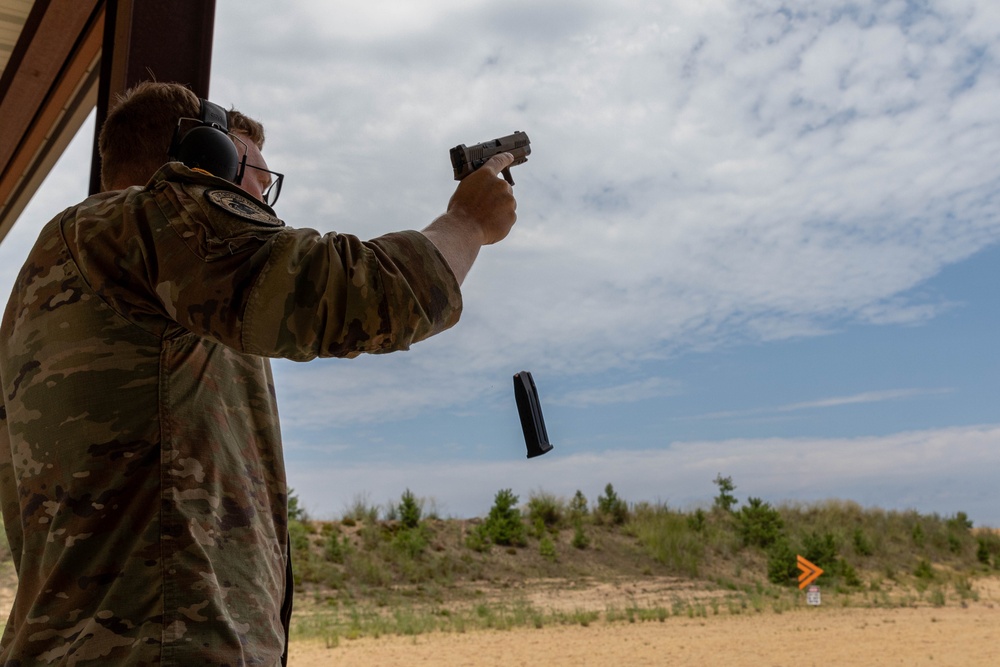 Sgt. Thomas Hunt reloads his M17 pistol