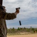 Sgt. Thomas Hunt reloads his M17 pistol