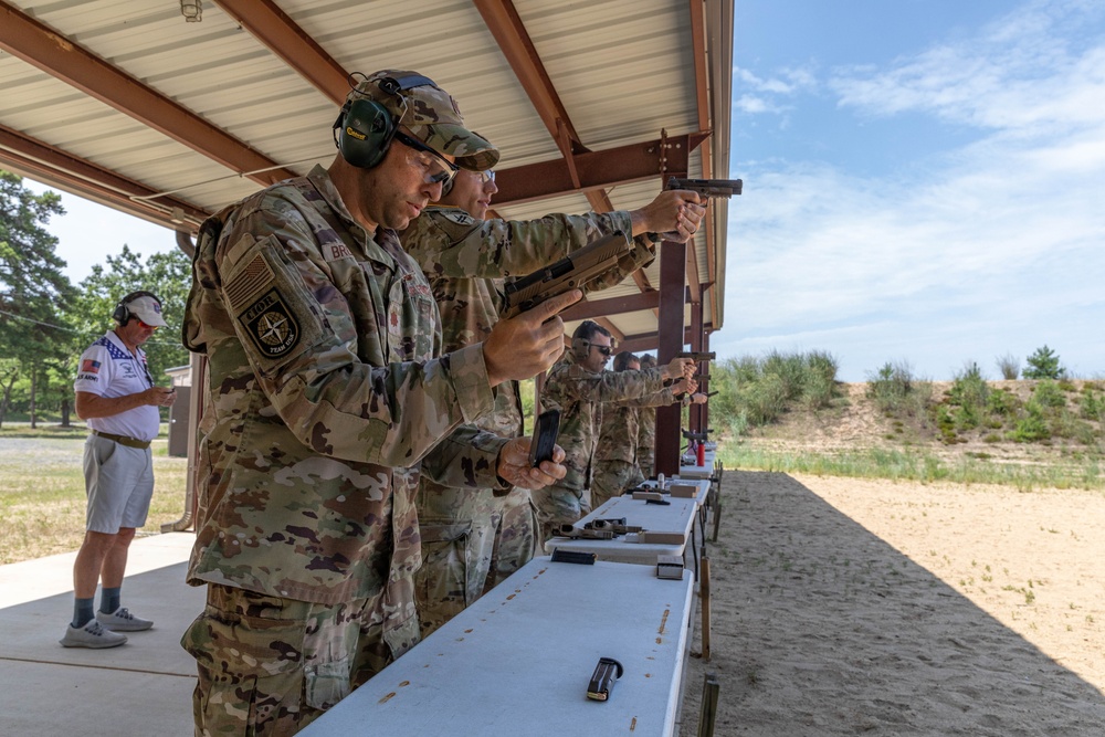 Maj. Sterling Broadhead reloads his M17 pistol