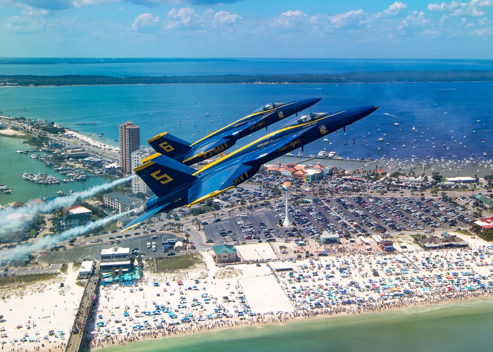 The Navy Flight Demonstration Squadron, the Blue Angels, perform in Pensacola Beach, FL.